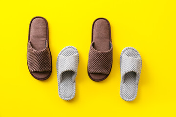 Soft slippers on color background