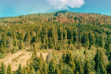 Mountains ridge on a sunny day. Transmission facilities in the mountain. Beautiful nature landscape. Europe, Carpathian mountains