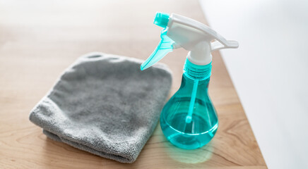 All purpose cleaner disinfectant spray bottle with towel to clean surfaces at home kitchen.