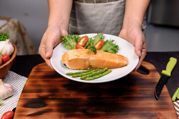 Fresh Salmon steak with salad. Online learning for cooking diet and healthy food when stay at home...