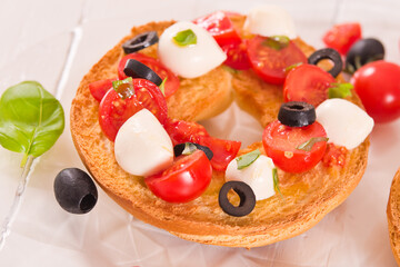 Friselle with tomatoes and mozzarella cheese.
