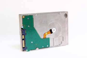 Hard disk stands on a side edge on a white background close-up