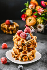 Belgian or french waffles for breakfast. Beautiful serve waffer cake with berries