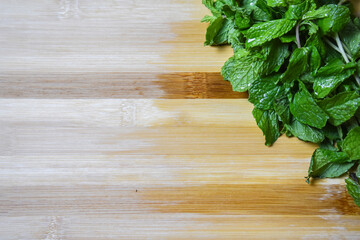 fresh mint leaves on wooden chopping board