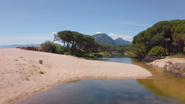 4k drone forward video (Ultra High Definition). Beautiful morning view of Osala Beach. Sunny summer scene of Sardinia island, Italy, Europe. Stunning seascape of Mediterranean sea.