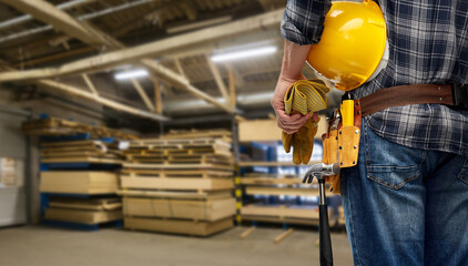 industry, production and job concept - close up of male worker or builder with helmet and working...