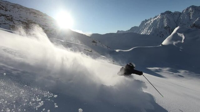 Professional freeriding in deep powder in the tyrolean mountains. Very stady filming. Perfect playground for professionals with the best view you can find. Slomotion video.