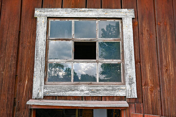 old barn with broken window in Kumla Sweden