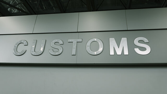 Airport customs declare sign on the wall at international terminal. Customs declare for import and export concept