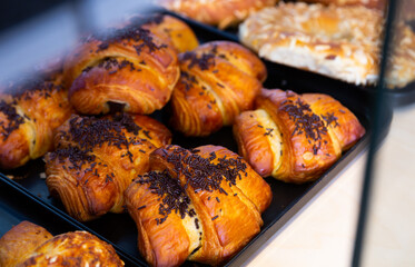 Chocolate croissants, spanish dessert on counter in supermarket