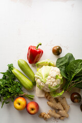 Fresh organic produce on white surface
