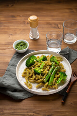 Whole wheat pasta with broccoli and asparagus, fusilli close up