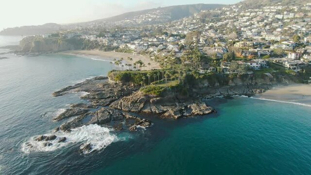 Beautiful natural laguna beach drone aerial in southern California sunshine sunset clouds sky sun sunny environment travel view scene peak weather
