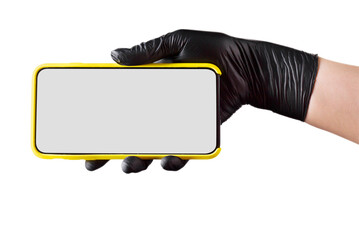 Hand in black glove holding mobile phone with blank screen isolated on white