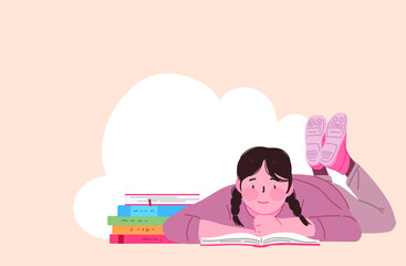 엎드려서 책을 읽는 여자아이