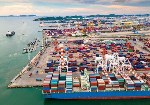 Aerial view of Deep water port with cargo ship and container.