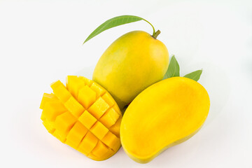 Mango fruit with mango cubes and slices. Isolated on a white background.