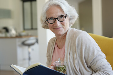 Portrait of senior woman drinking herbal tea