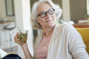 Portrait of senior woman drinking herbal tea