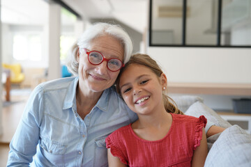 Portrait of smiling grandmother with grandkid - obrazy, fototapety, plakaty