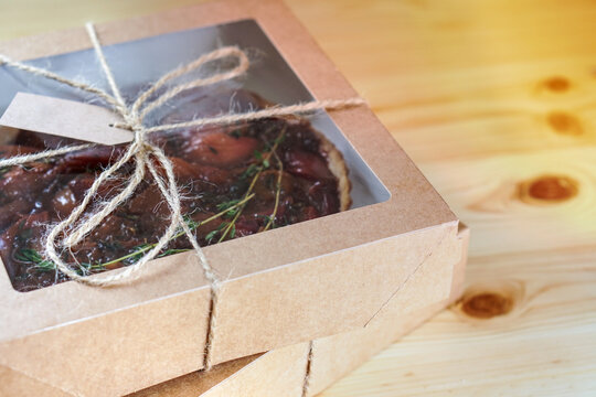 Homemade cake packed in an craft box. Ecological package concept