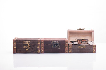 Set of miniature treasure chests isolated over white