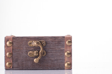 A miniature treasure chest isolated over white