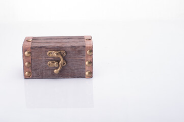 A miniature treasure chest isolated over white