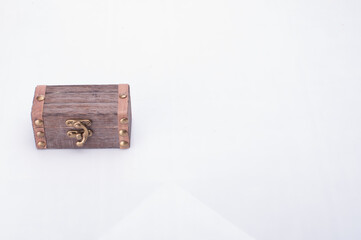 A miniature treasure chest isolated over white