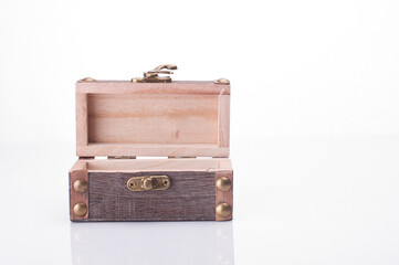 A miniature treasure chest isolated over white