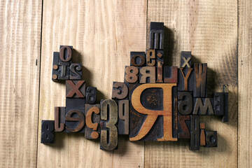 letters in wooden printing blocks of different sizes and typefaces