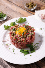 beef tartare- french gastronomy with egg yolk
