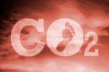 CO2 and carbon footprint against a warm orange background