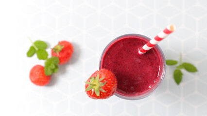 strawberry smoothie and straw- top view