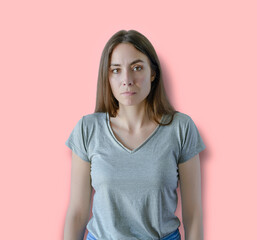 Fototapeta premium Portrait of an upset unsatisfied woman standing and looking
