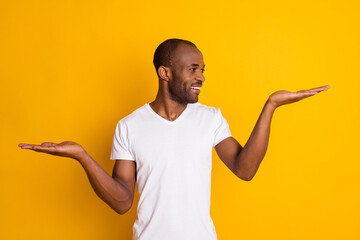 Portrait of positive afro american guy hold hand demonstrate ads promo recommend suggest select...