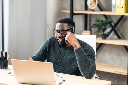 African-American Guy With Headset Using Laptop