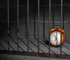 retro red alarm clock at about 7 o'clock on jail or prisoner room time restrict concept.