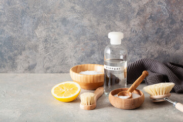 zero waste eco friendly cleaning concept. wooden brushes, lemon, baking soda, vinegar