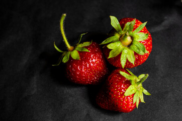 fresh strawberries on a black background