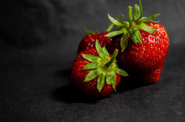 fresh strawberries on a black background