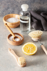 zero waste eco friendly cleaning concept. wooden brushes, lemon, baking soda, vinegar