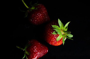fresh strawberries on a black background
