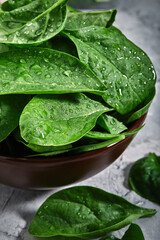 Fresh spinach leaves, with dew drops, close-up, grocery delivery. Healthy organic foods. Vegetarian...
