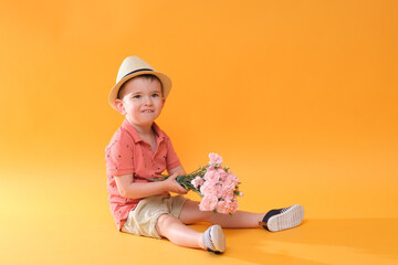 Litle cute boy with bunch of flower. Holiday mood on! 