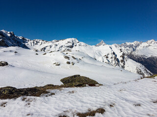 Panoramic view of the snow capped mountains of the Simplon pass in Switzerland.