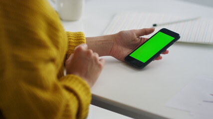 Closeup woman hands surfing internet on smartphone. Girl relaxing with mobile