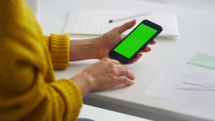 Close up businesswoman hands surfing internet on smartphone in slow motion.