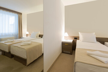 Interior of a modern new double bed hotel bedroom