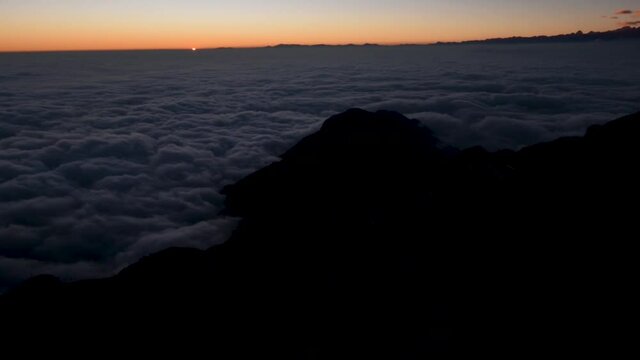 Timelapse of sunset above clouds and mountains from Zuluk, Sikkim, India